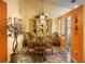 Elegant dining room with glass-top table and ornate chairs at 553 Whittingham Pl, Lake Mary, FL 32746