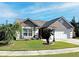 Attractive one-story home with landscaped lawn and driveway at 553 Whittingham Pl, Lake Mary, FL 32746