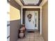 Inviting front entry with decorative pots and wreath at 553 Whittingham Pl, Lake Mary, FL 32746