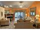 Spacious living room featuring fireplace and comfy sofas at 553 Whittingham Pl, Lake Mary, FL 32746