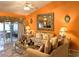 Bright living room with large mirror and ample seating at 553 Whittingham Pl, Lake Mary, FL 32746
