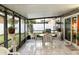 Relaxing screened porch with tiled floor and patio furniture at 553 Whittingham Pl, Lake Mary, FL 32746