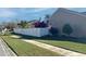 Landscaped side yard with white vinyl fence at 553 Whittingham Pl, Lake Mary, FL 32746