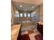 Elegant bathroom with a walk-in shower, soaking tub, and double vanity at 556 Lake Wildmere Cv, Longwood, FL 32750