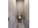 Small bathroom with toilet and gray walls at 556 Lake Wildmere Cv, Longwood, FL 32750