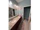 Double vanity bathroom with granite countertop at 556 Lake Wildmere Cv, Longwood, FL 32750