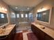 Bathroom with double vanity and large walk-in shower at 556 Lake Wildmere Cv, Longwood, FL 32750