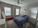 Cozy bedroom with a comfy bed and plenty of natural light at 556 Lake Wildmere Cv, Longwood, FL 32750