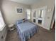 Comfortable bedroom with mirrored closet doors at 556 Lake Wildmere Cv, Longwood, FL 32750