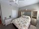 Charming bedroom with floral bedding and built-in shelving at 556 Lake Wildmere Cv, Longwood, FL 32750