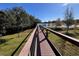 Community boardwalk with lake views at 556 Lake Wildmere Cv, Longwood, FL 32750