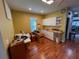Spacious craft room featuring built-in cabinetry and hardwood floors at 556 Lake Wildmere Cv, Longwood, FL 32750