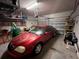 Attached garage with shelving and ample storage space at 556 Lake Wildmere Cv, Longwood, FL 32750