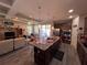 Open concept kitchen with island, stainless steel appliances and living room view at 556 Lake Wildmere Cv, Longwood, FL 32750