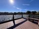 Peaceful lake view with dock and bench at 556 Lake Wildmere Cv, Longwood, FL 32750