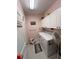 Laundry room with washer, dryer, and cabinets at 556 Lake Wildmere Cv, Longwood, FL 32750