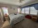 Spacious main bedroom with king-size bed and ample natural light at 556 Lake Wildmere Cv, Longwood, FL 32750