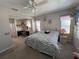 Large main bedroom with a king-size bed and an ensuite office at 556 Lake Wildmere Cv, Longwood, FL 32750