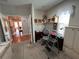 Home office with built-in shelving and hardwood floors at 556 Lake Wildmere Cv, Longwood, FL 32750