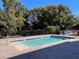 Community pool with seating and a shaded area at 556 Lake Wildmere Cv, Longwood, FL 32750
