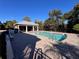 Community pool with a relaxing patio area at 556 Lake Wildmere Cv, Longwood, FL 32750