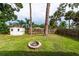 Large backyard with shed, firepit, and mature trees at 603 Conrad Dr, New Smyrna Beach, FL 32168