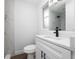 Modern bathroom with white vanity and marble tile shower at 603 Conrad Dr, New Smyrna Beach, FL 32168
