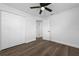 Spacious bedroom featuring wood-look floors and a double door closet at 603 Conrad Dr, New Smyrna Beach, FL 32168