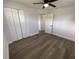 Bright bedroom with wood-look floors and double door closet at 603 Conrad Dr, New Smyrna Beach, FL 32168