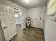 Laundry room with vinyl flooring and water heater at 603 Conrad Dr, New Smyrna Beach, FL 32168
