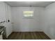Laundry room with vinyl flooring, window, and washer hookups at 603 Conrad Dr, New Smyrna Beach, FL 32168