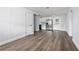 Bright living room featuring luxury vinyl plank flooring and an open floor plan at 603 Conrad Dr, New Smyrna Beach, FL 32168