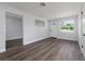 Spacious living room with vinyl flooring and neutral wall colors at 603 Conrad Dr, New Smyrna Beach, FL 32168