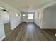 Living area with vinyl flooring and neutral decor at 603 Conrad Dr, New Smyrna Beach, FL 32168