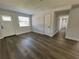 Living room with gray vinyl flooring and neutral walls at 603 Conrad Dr, New Smyrna Beach, FL 32168