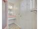 Small bathroom with pink tile and built-in vanity at 708 Balmoral Rd, Winter Park, FL 32789