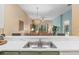 Kitchen with a breakfast bar overlooking the living and dining area at 108 Paradise Parade # 23, Davenport, FL 33897