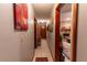 Long hallway with tile floors and artwork leading to other rooms at 1094 Red Dandy Dr, Orlando, FL 32818
