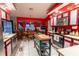 Updated kitchen with red and gray cabinets and an island at 1094 Red Dandy Dr, Orlando, FL 32818