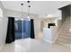 Dining area with tile floors, pendant lights, and sliding doors to a patio at 14053 Wild Majestic St, Orlando, FL 32828
