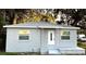 Newly painted gray house with white door, steps, and porch at 1416 34Th St, Orlando, FL 32839