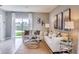 Living room with sliding glass doors and water view at 1610 Bull Hill Rd, Kissimmee, FL 34744