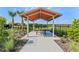 Covered picnic table with surrounding landscaping at 1610 Bull Hill Rd, Kissimmee, FL 34744