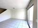 Spacious living room with tiled floors and sliding glass doors at 1815 Townhall Ln # 1815, Orlando, FL 32807