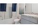 Clean bathroom with a single vanity and a tub shower combination at 4807 Khloe Ct, Winter Haven, FL 33884
