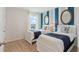 Charming bedroom with two twin beds and blue striped walls at 4807 Khloe Ct, Winter Haven, FL 33884