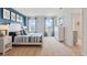 Main bedroom with blue accent wall and king-size bed at 4807 Khloe Ct, Winter Haven, FL 33884