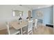 Dining room with light-colored table and chairs, view to living room at 4807 Khloe Ct, Winter Haven, FL 33884