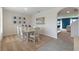 Bright dining room with a light wooden table and six chairs at 4807 Khloe Ct, Winter Haven, FL 33884
