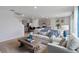 Living room with light couch and view of kitchen and stairs at 4807 Khloe Ct, Winter Haven, FL 33884